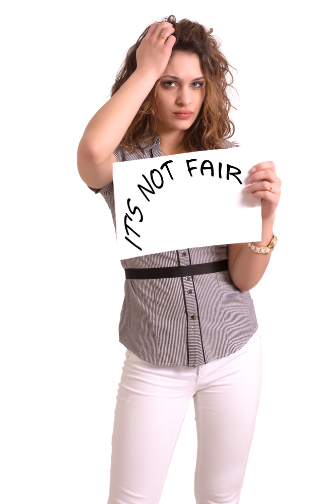 Girl_with_Not_Fair_sign